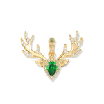 Gold-plated Björn Hirsch pendant from the DREAM series with an abstract deer head, branched antlers, and a teardrop-shaped green zirconia in the center