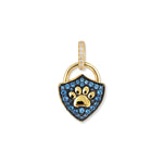 Gold-plated Royal Paw lock pendant with a triangular shape, raised frosted paw relief, blue zirconia, and targeted oxidation behind the stones