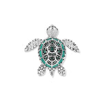 Detailed turtle in rhodium-plated silver with a green enamel shell and sparkling green cubic zirconia, inspired by tranquil aquatic worlds