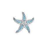 Silberner Seestern mit türkisfarbenen Zirkonia in den Armen und funkelndem Stein im Zentrum, inspiriert von klarem Meerwasser
