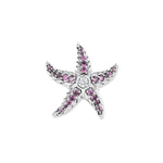 Silver starfish with pink and fuchsia cubic zirconia in the arms and a sparkling stone in the center, inspired by colorful underwater worlds