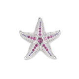 Großer silberner Seestern mit pinken und violetten Zirkonia sowie feinen weißen Lichtakzenten, detailreich gearbeitet als Masterpiece der Wasserwelten